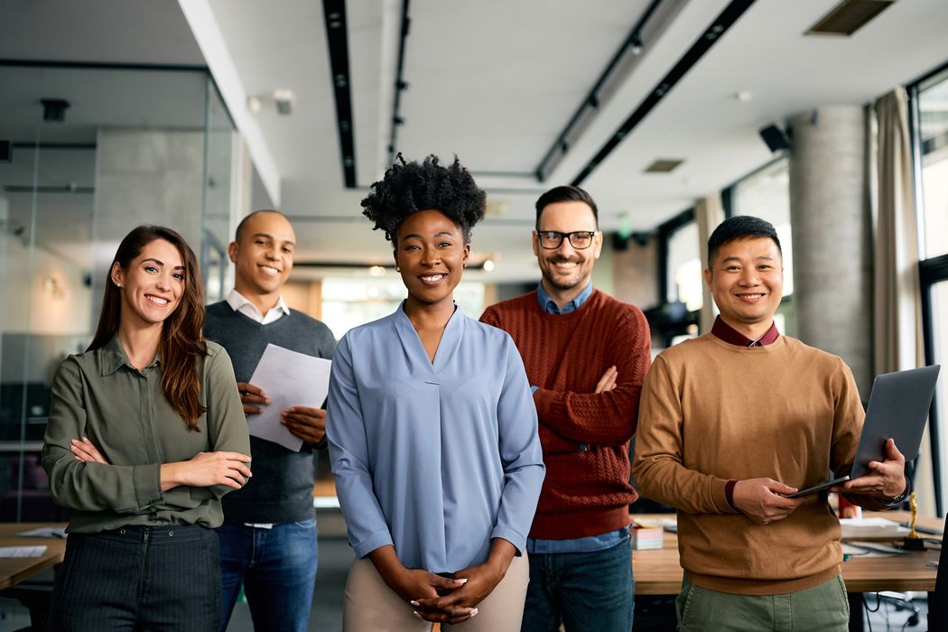 Diverse group of office workers on a modern meeting room Diverse group of office workers on a modern meeting room