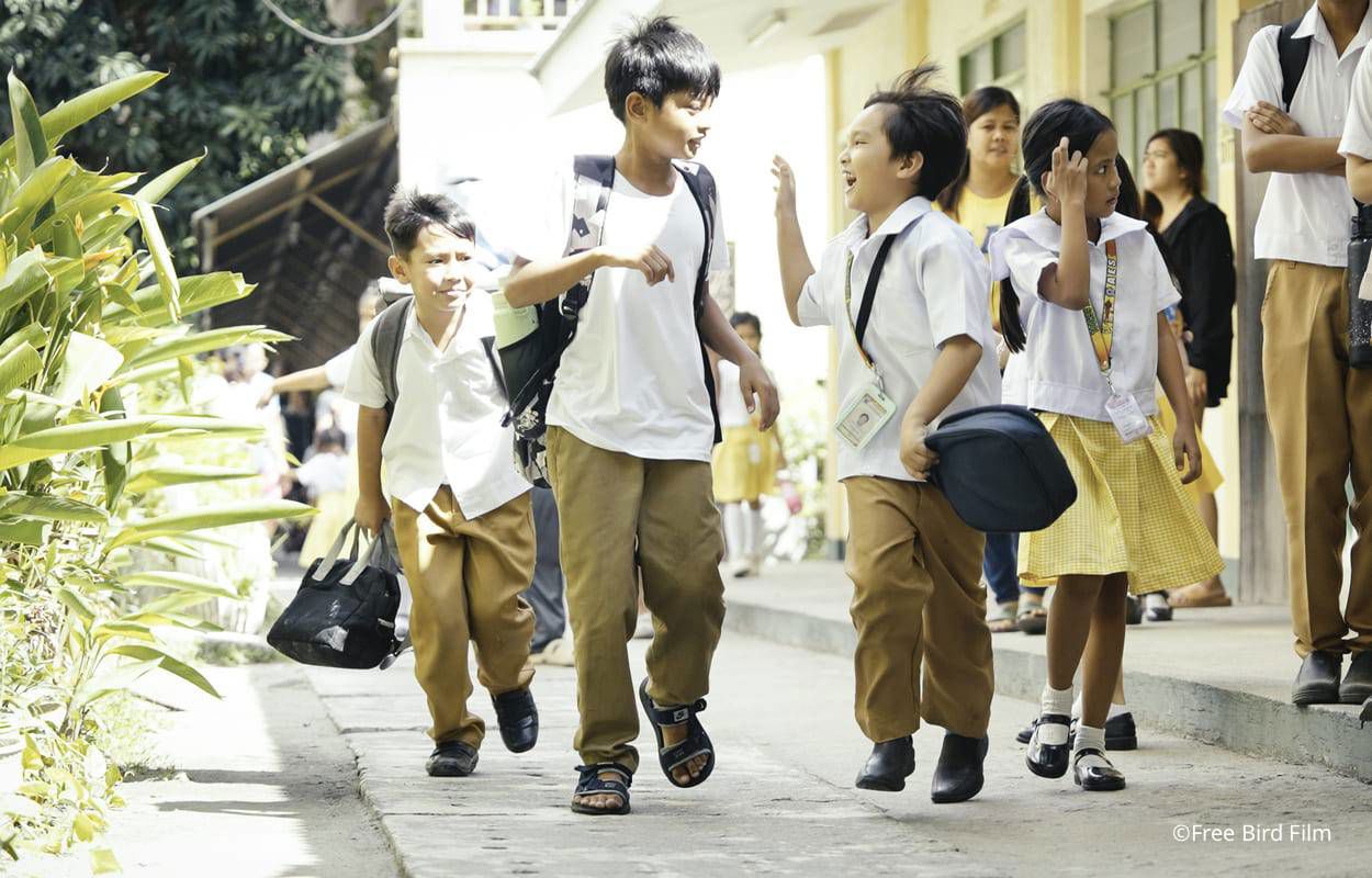 Two smiling boys having fun together in the Philippines, illustrating TP’s partnership with UNICEF. Two smiling boys having fun together in the Philippines, illustrating TP’s partnership with UNICEF.