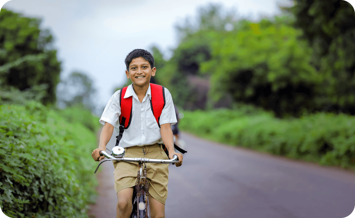 Smiling boy riding a bicycle on the streets Smiling boy riding a bicycle on the streets