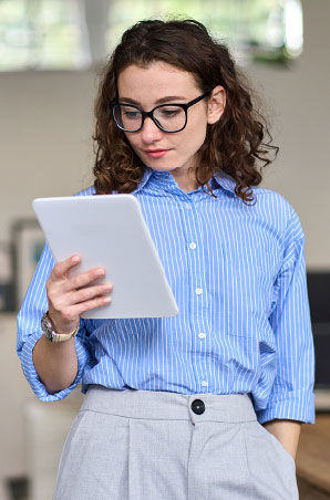 Young business woman reading on her tablet Young business woman reading on her tablet
